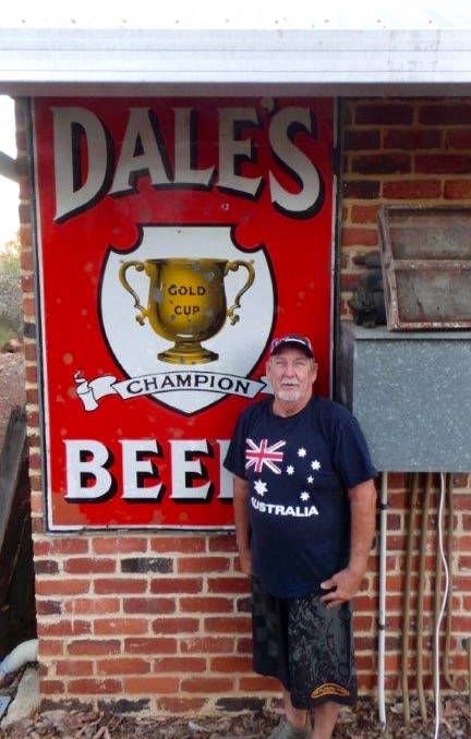 Dale Miller with a Dale's Brewery sign